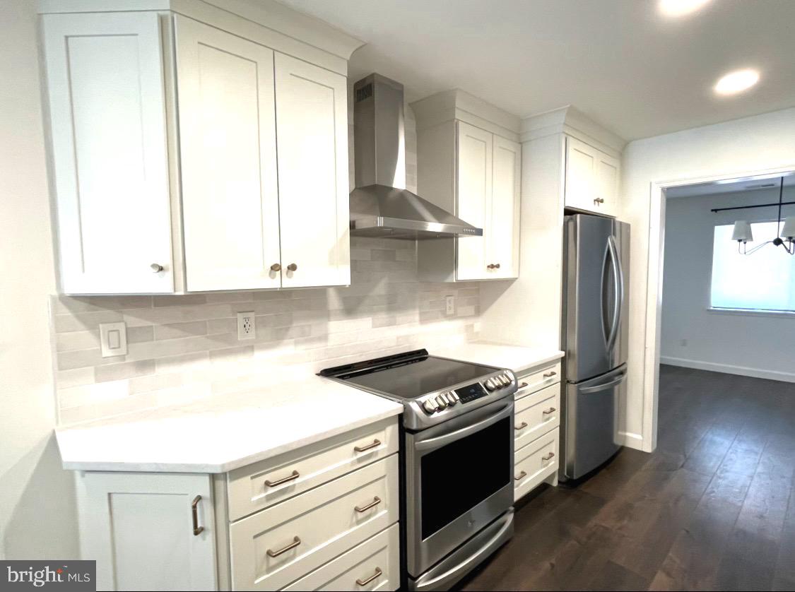 1106 Brinton Place Road, Unit 29 West Chester, PA 19380 - Photo 7 of 25 a kitchen with stainless steel appliances granite countertop a stove and a refrigerator