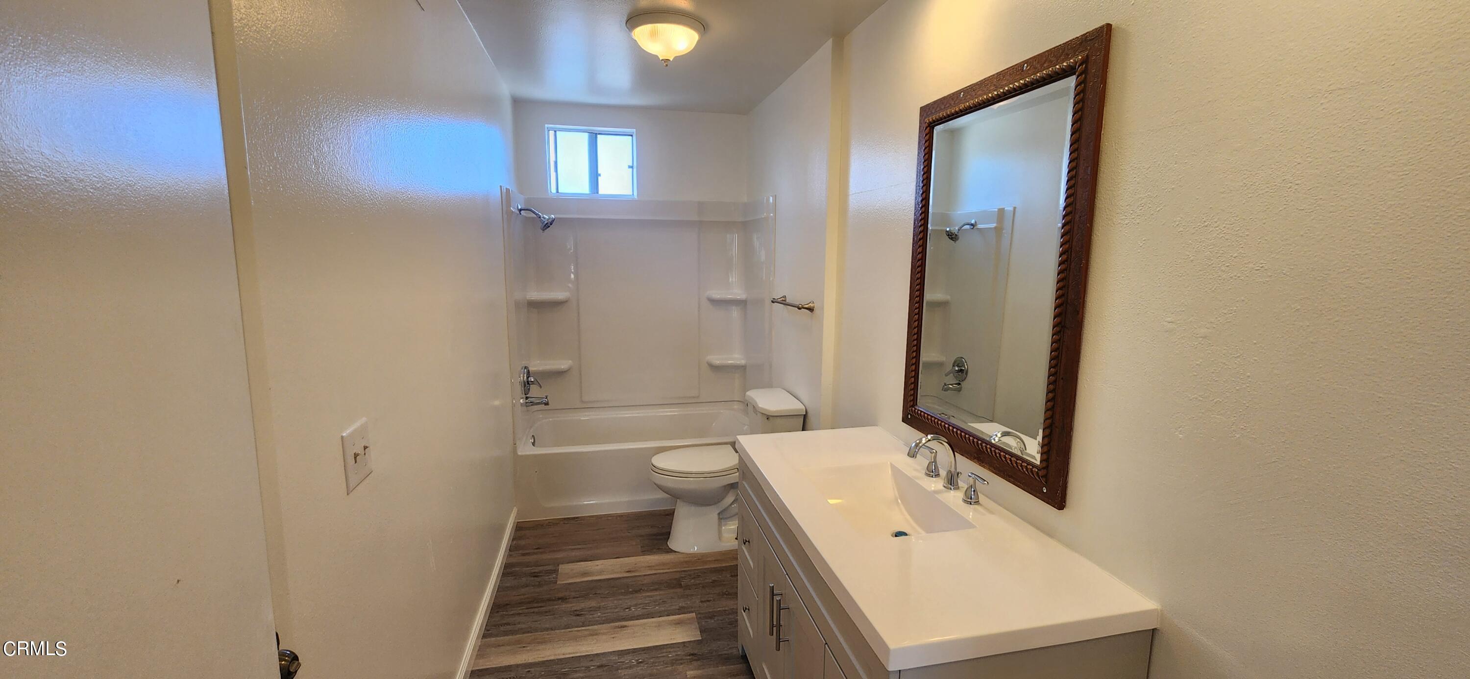 551 South E Street Oxnard, CA 93030 - Photo 13 of 18 a bathroom with a sink a toilet and shower