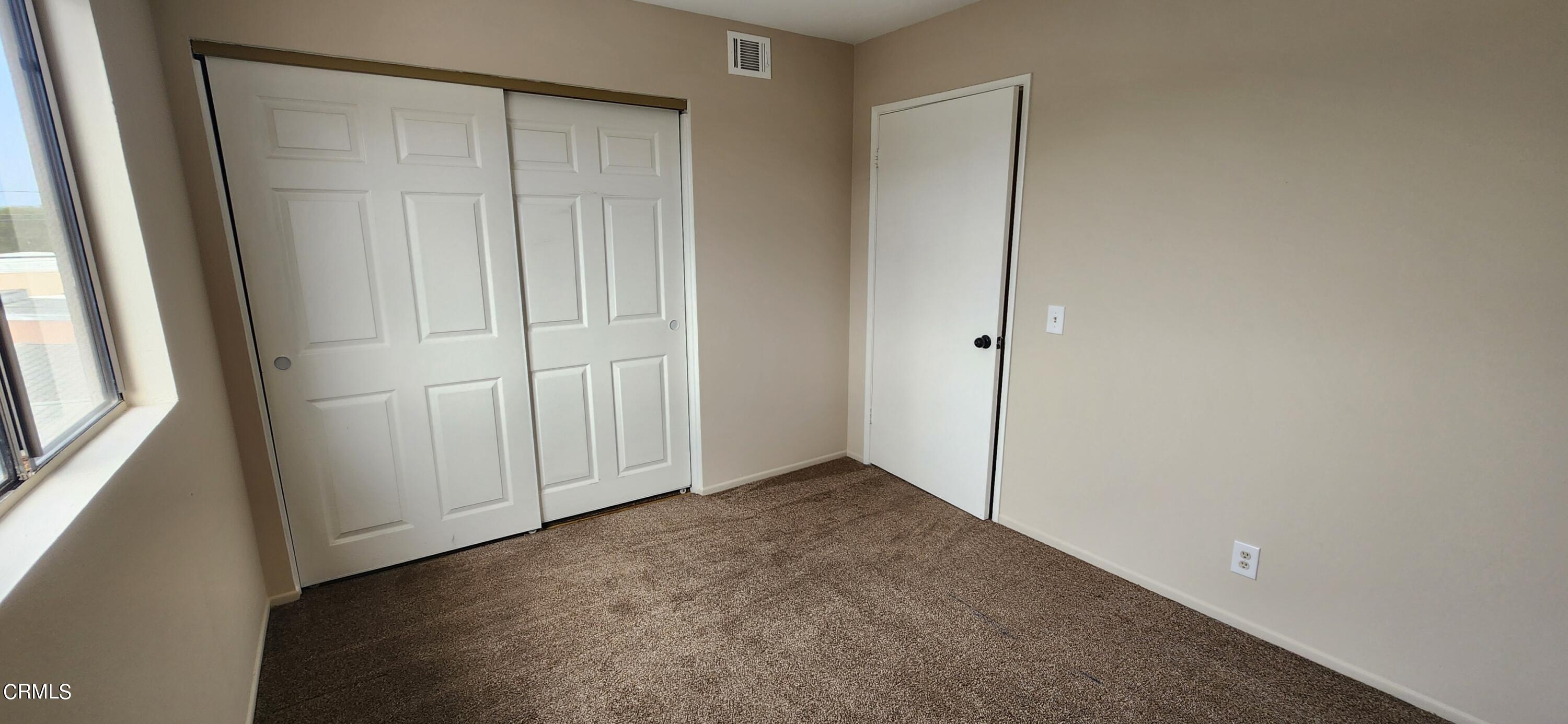 551 South E Street Oxnard, CA 93030 - Photo 14 of 18 an empty room with a door