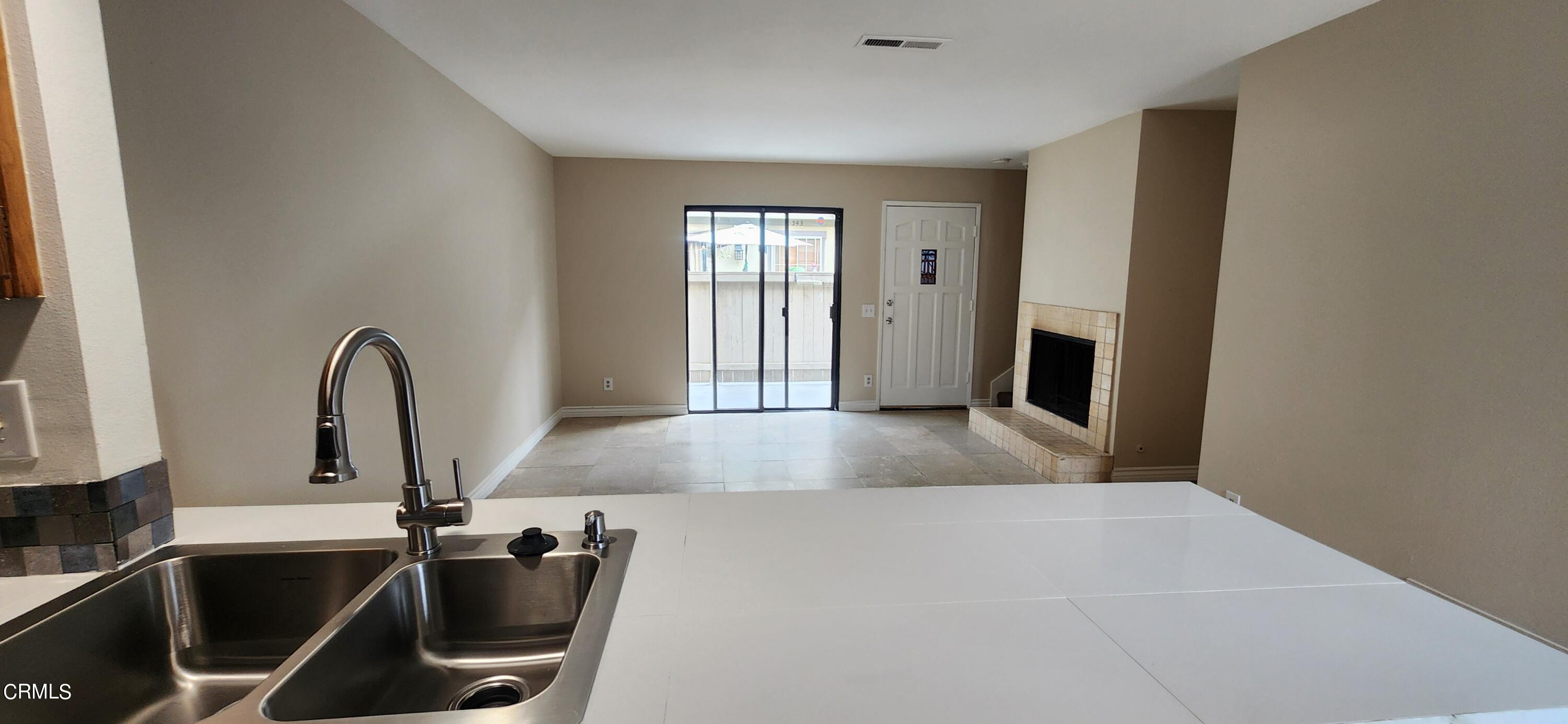 551 South E Street Oxnard, CA 93030 - Photo 5 of 18 a view of a kitchen with a sink and a large window