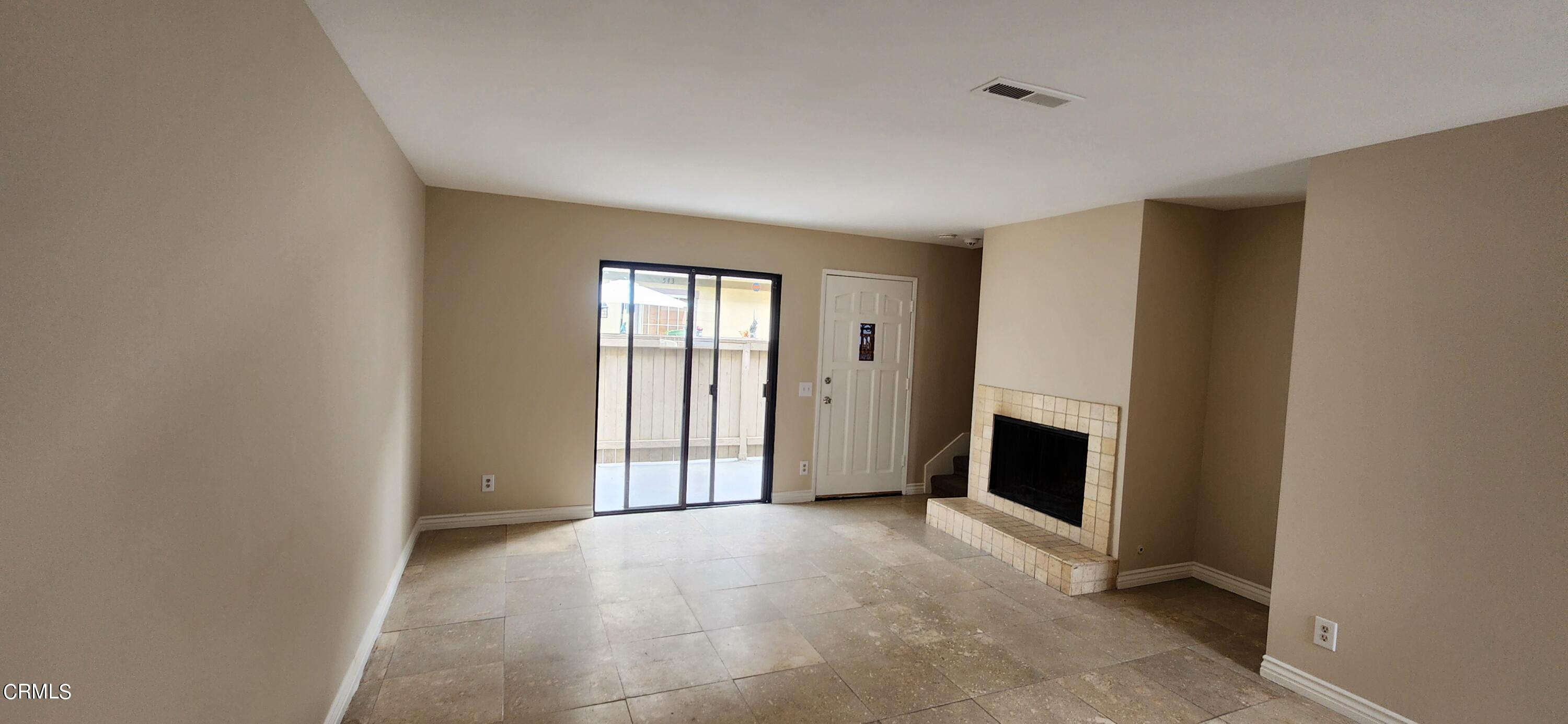 551 South E Street Oxnard, CA 93030 - Photo 6 of 18 a view of an empty room with a fireplace
