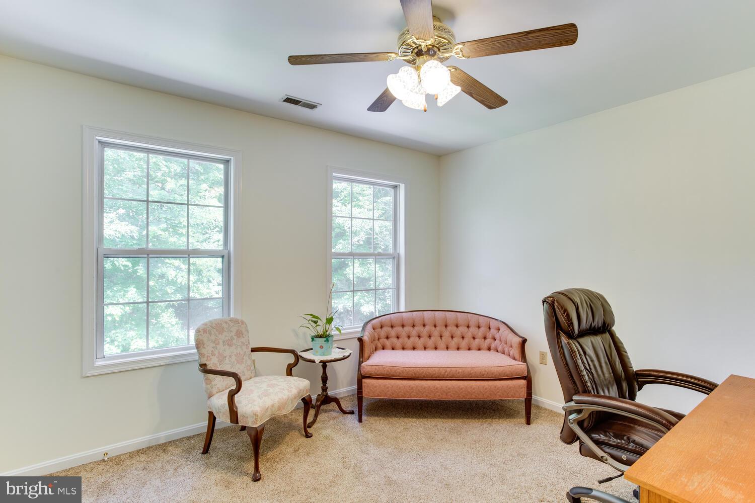 6029 Hillside Road St. Leonard, MD 20685 - Photo 12 of 15 a bedroom with a bed and a chandelier