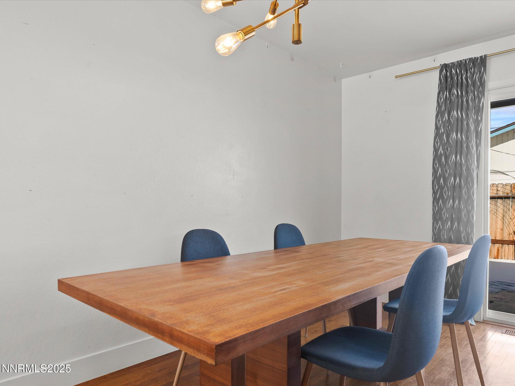 301 Hillcrest Drive Reno, NV 89509 - Photo 16 of 40 a view of a dining room with furniture and wooden floor