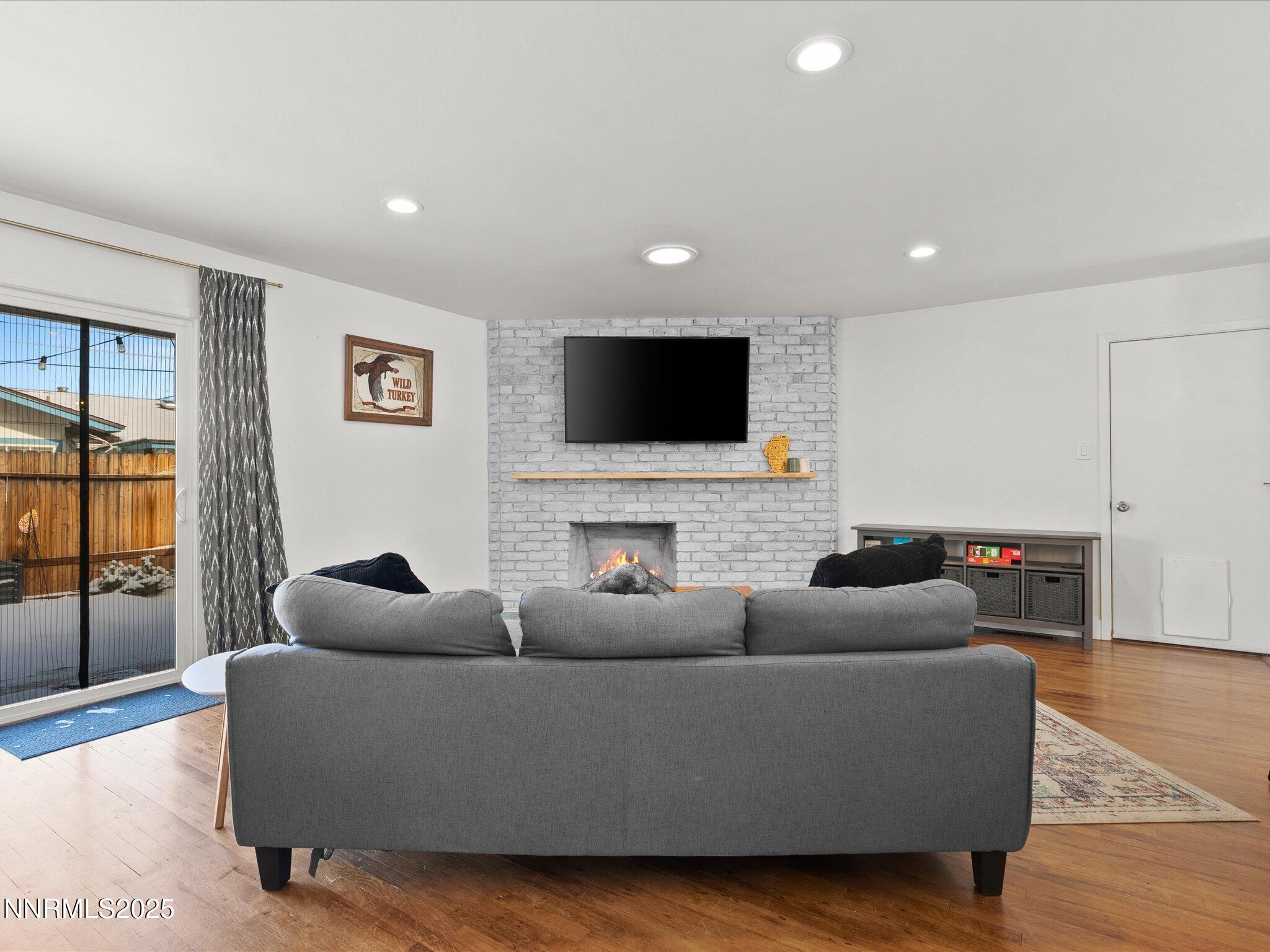 301 Hillcrest Drive Reno, NV 89509 - Photo 19 of 40 a living room with furniture and a flat screen tv