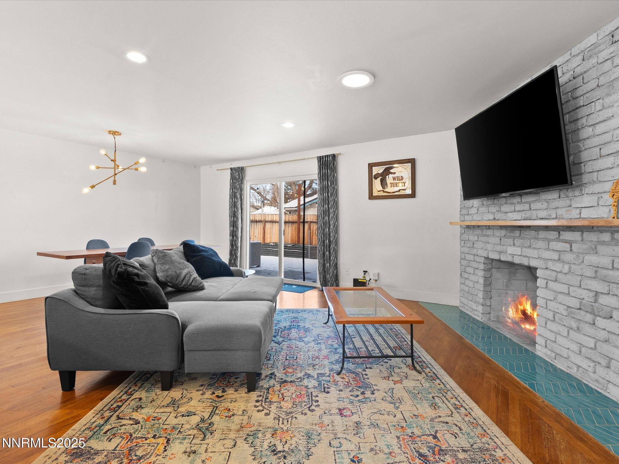 301 Hillcrest Drive Reno, NV 89509 - Photo 22 of 40 a living room with furniture and a fireplace
