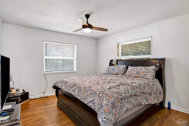 a bedroom with bed and window