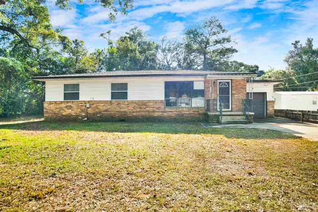 a view of backyard with swimming pool and outdoor seating