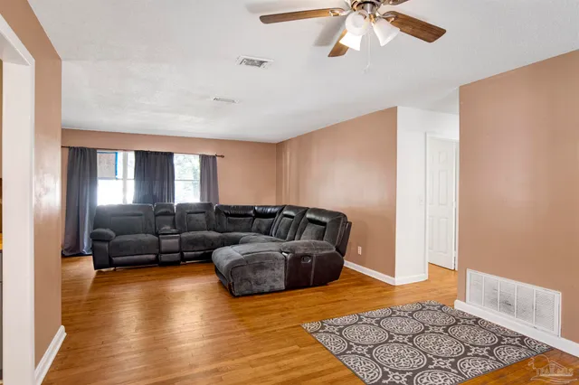 a living room with furniture and a rug