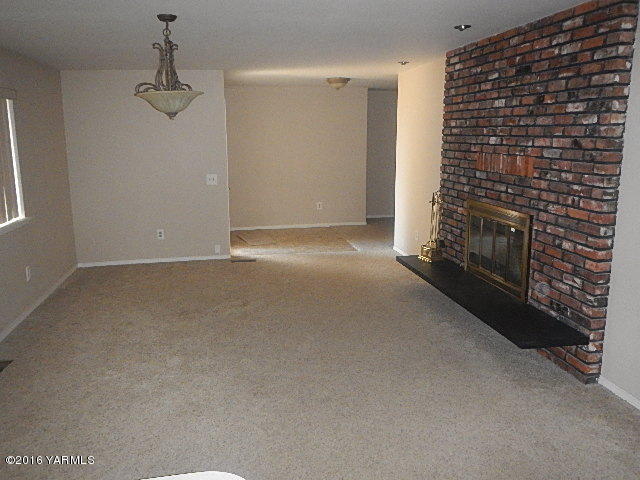 505 Bittner Road Yakima, WA 98901 - Photo 6 of 14 a view of an empty room and a fireplace