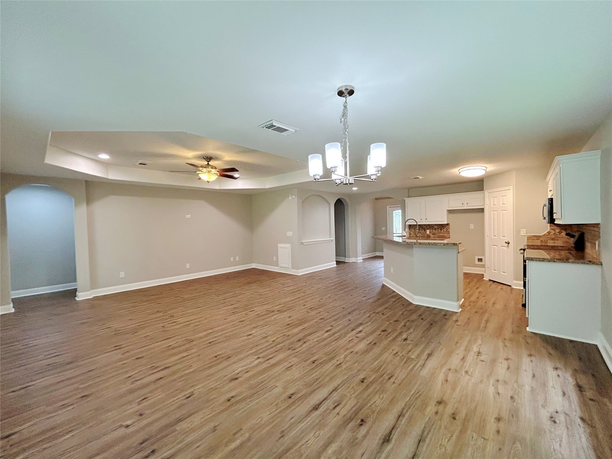 7902 Masters Manvel, TX 77578 - Photo 9 of 21 Another view of the island kitchen, dining area and den.