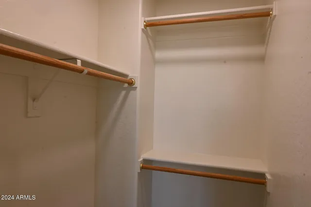 a bathroom with a sink toilet vanity and shower