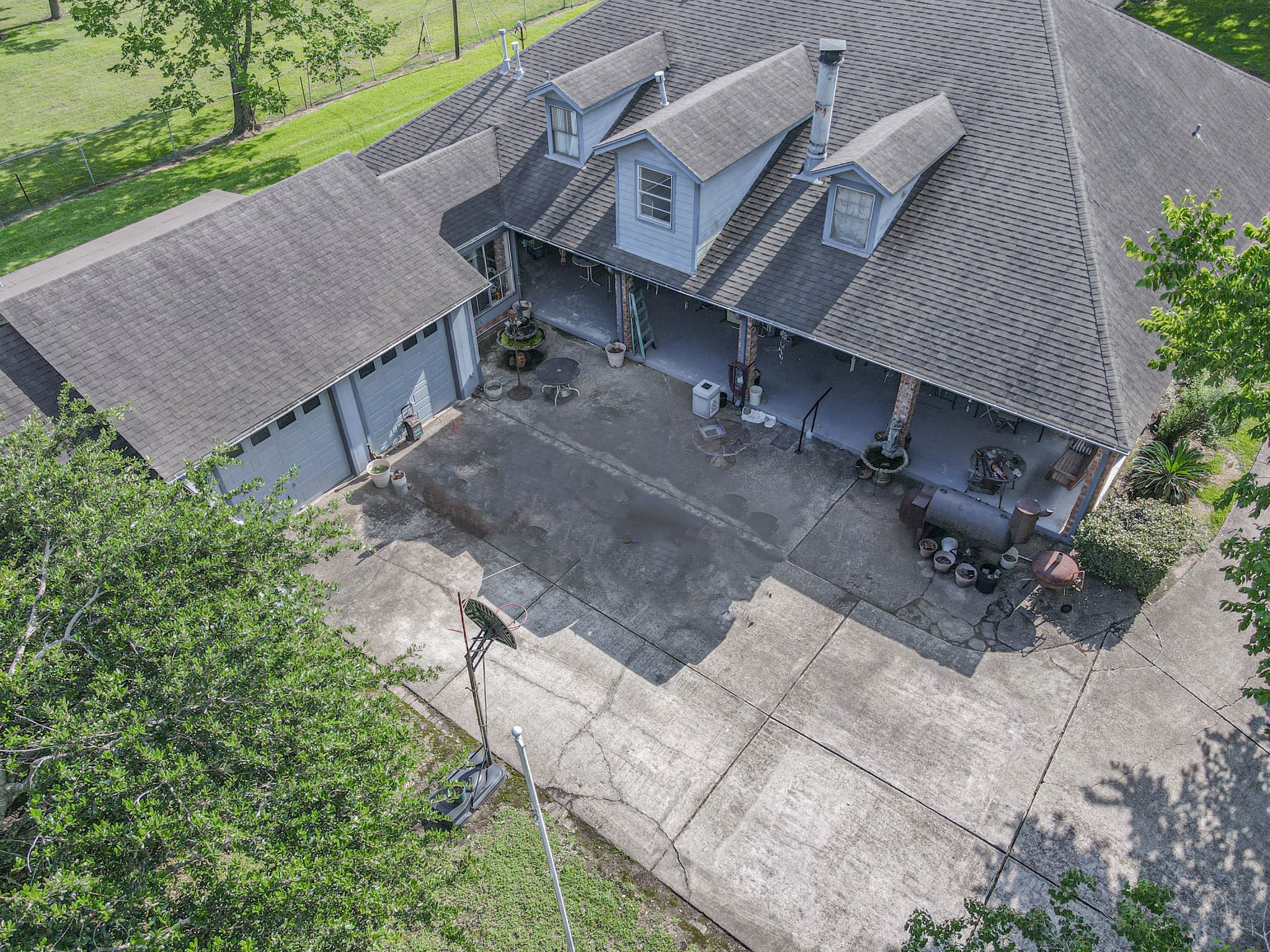 4503 Allen-Genoa Road Pasadena, TX 77504 - Photo 42 of 50 AERIAL VIEW OF 2 CAR ATTACHED GARAGE, SUN ROOM OR WORKSHOP (BETWEEN HOME & GARAGE), TONS OF PARKING AND WRAP AROUND PORCH! WHAT MORE COULD YOU ASK FOR?