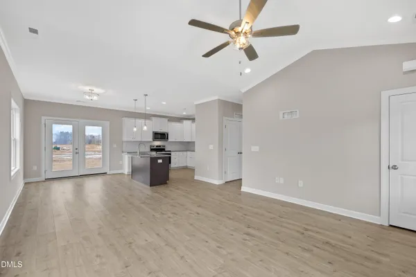 a kitchen with granite countertop a stove and a sink