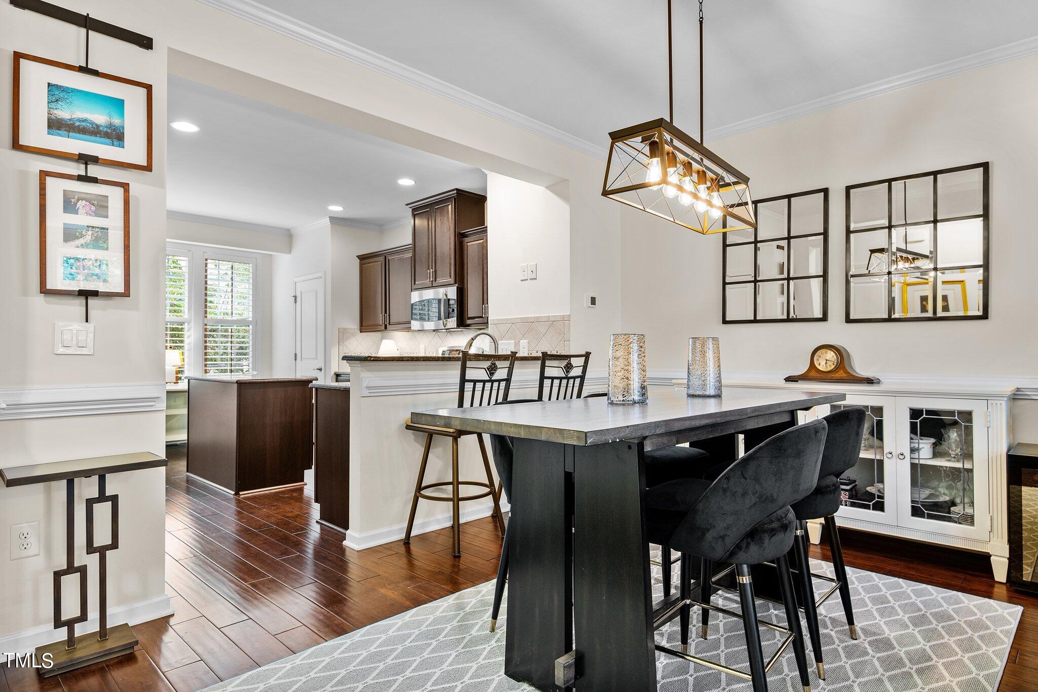 5657 Wade Park Boulevard Raleigh, NC 27607 - Photo 6 of 24 Dining room off of the Kitchen with Hardwood Flooring.