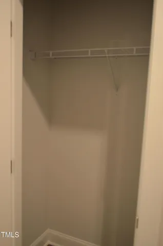 a view of a room with racks on the wall