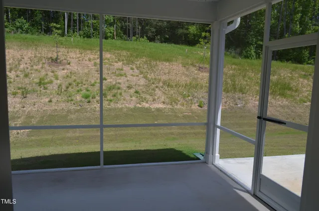 a view of a glass door and porch