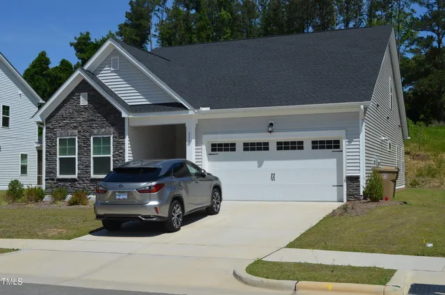 a view of a car parked in front of a house