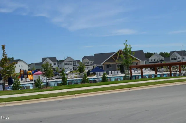 a view of houses with street and trees