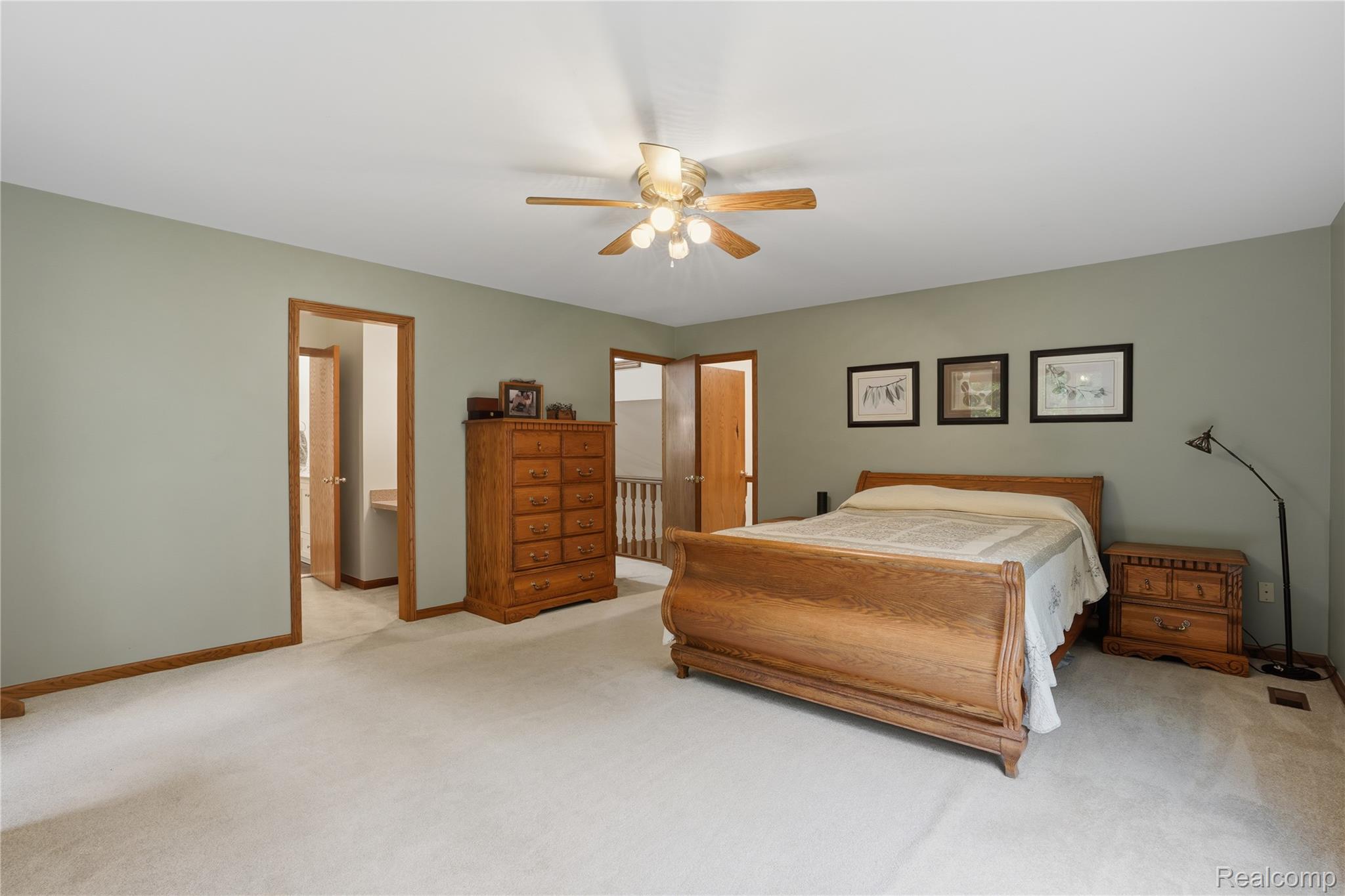 68345 Romeo Plank Road Ray, MI 48096 - Photo 34 of 52 Carpeted room with a ceiling fan light fixture, painted walls, and wood trim around doorways