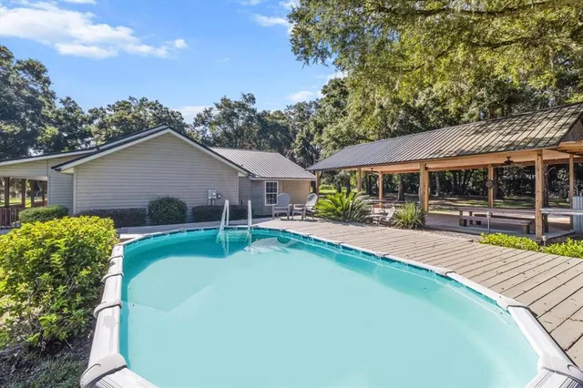a view of an house with backyard space and balcony