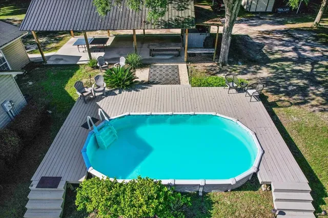 a view of a swimming pool with a patio