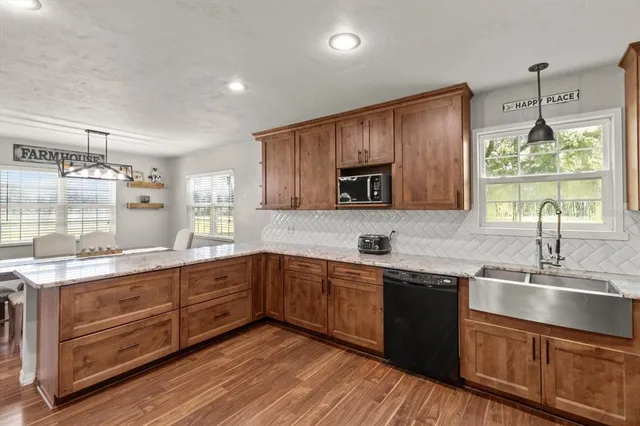 a kitchen with a sink stove and cabinets