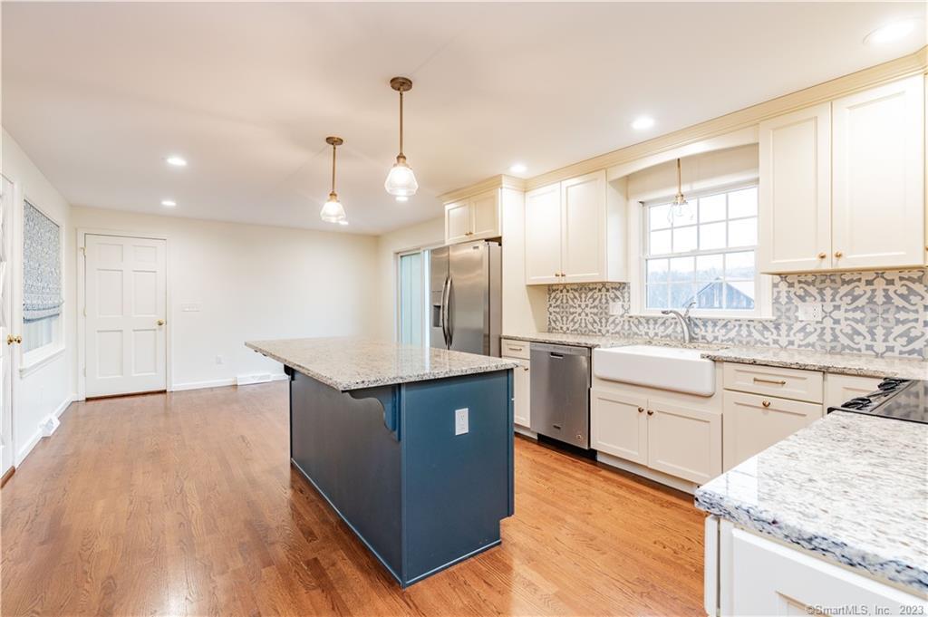 1241 Halladay Avenue West Suffield, CT 06078 - Photo 4 of 29 a kitchen with stainless steel appliances granite countertop a sink stove and refrigerator