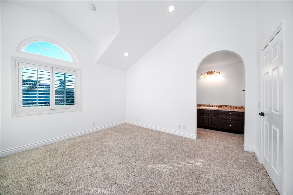 3 Almador Irvine, CA 92614 - Photo 15 of 35 an empty room with a fireplace and a window