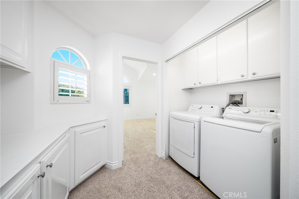 3 Almador Irvine, CA 92614 - Photo 17 of 35 a utility room with dryer and washer