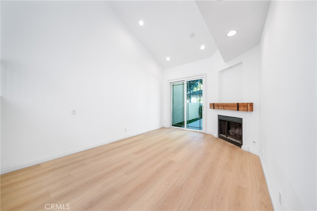 3 Almador Irvine, CA 92614 - Photo 6 of 35 a view of empty room with fireplace and window