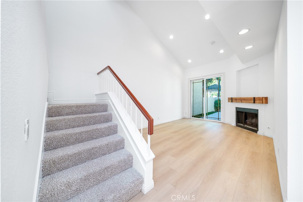 3 Almador Irvine, CA 92614 - Photo 8 of 35 a view of staircase and fireplace