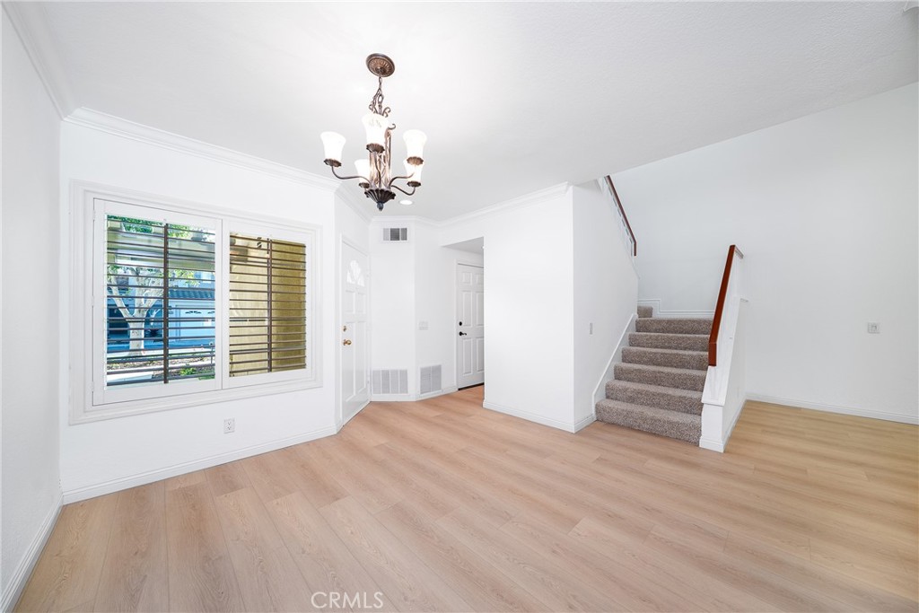3 Almador Irvine, CA 92614 - Photo 9 of 35 a view of an empty room with wooden floor and a window