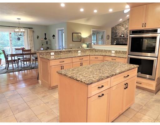 2 Lowry Lane Rutland, MA 01543 - Photo 12 of 30 a kitchen with stainless steel appliances granite countertop a stove a sink and a microwave