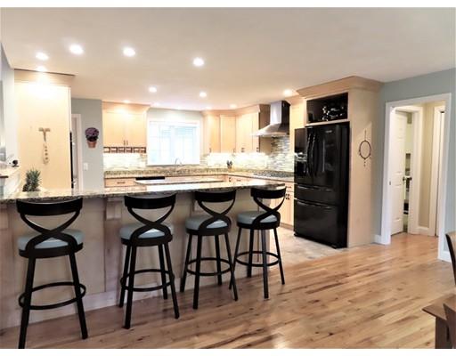 2 Lowry Lane Rutland, MA 01543 - Photo 13 of 30 a kitchen with stainless steel appliances kitchen island a table and chairs in it