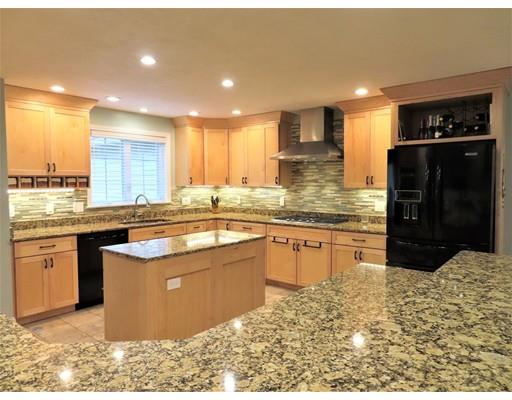 2 Lowry Lane Rutland, MA 01543 - Photo 10 of 30 a large kitchen with kitchen island granite countertop wooden cabinets a granite counter tops and a counter space