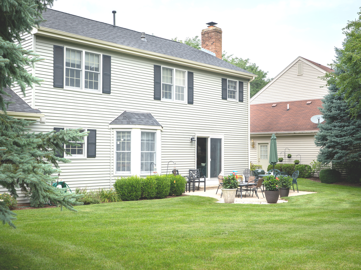1525 Forest Ridge Road St. Charles, IL 60174 - Photo 16 of 17 a front view of a house with a garden