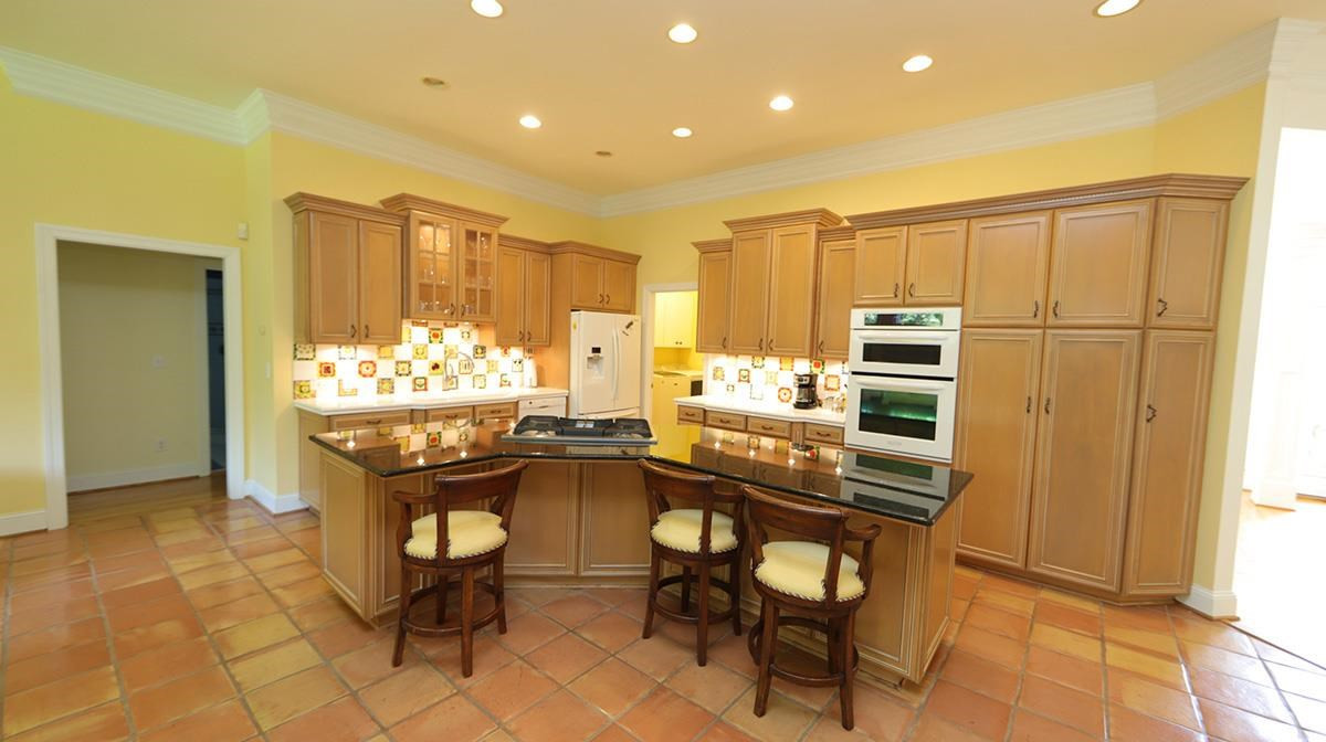 5817 Stone Spring Road Raleigh, NC 27613 - Photo 10 of 28 Fantastic Kitchen Island for Guest to take part in the Meal Prep and Cooking. All open to the Family Room ! Refrigerator Conveys. Chef's Dream