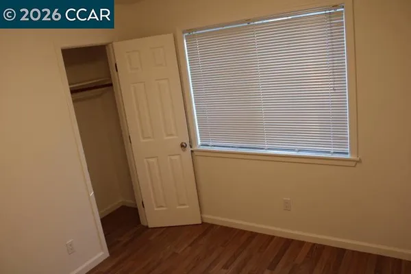 a view of a storage & utility room with a window