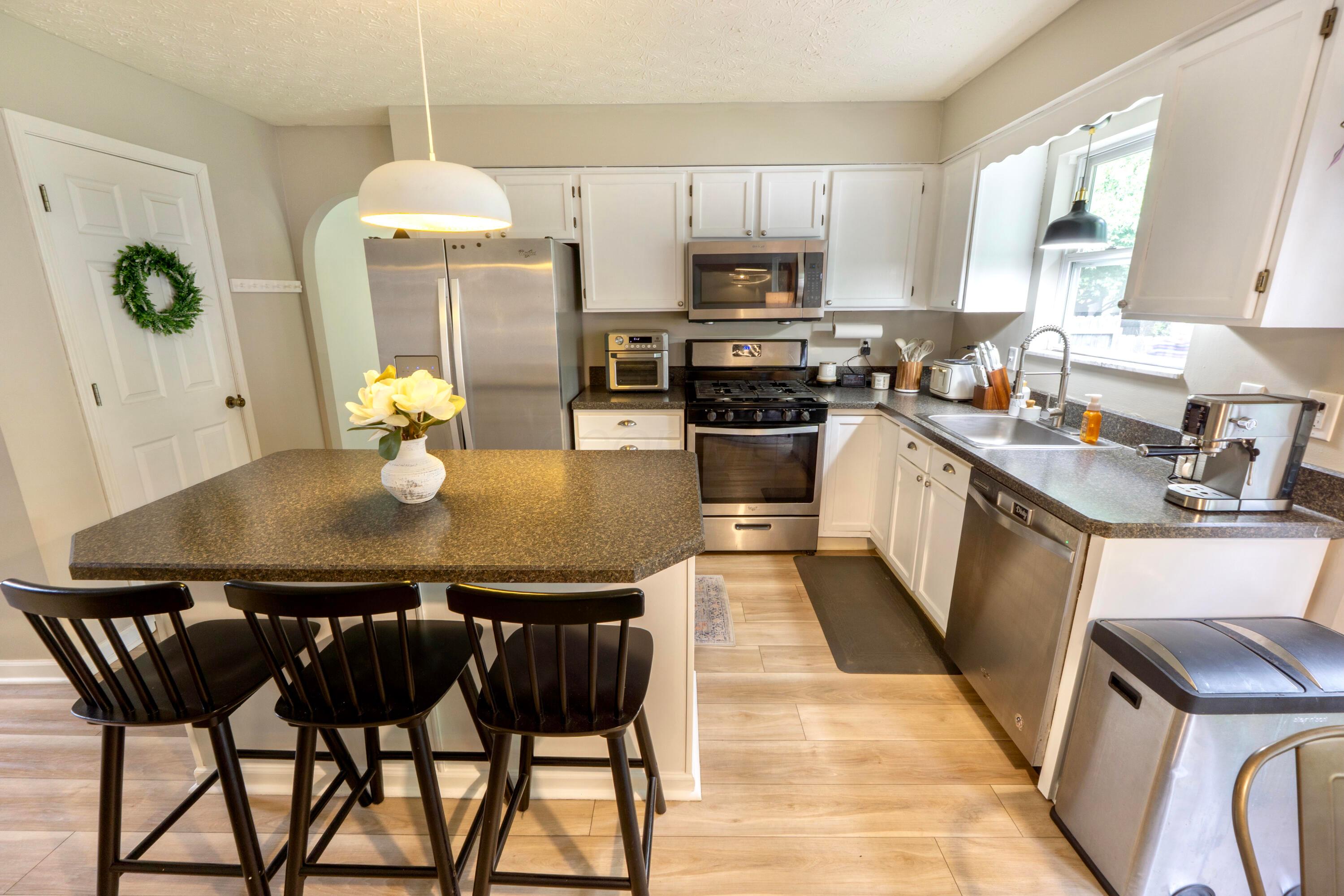 160 Kettering Bend Delaware, OH 43015 - Photo 11 of 49 White cabinets, updated light fixtures and beveled countertops!