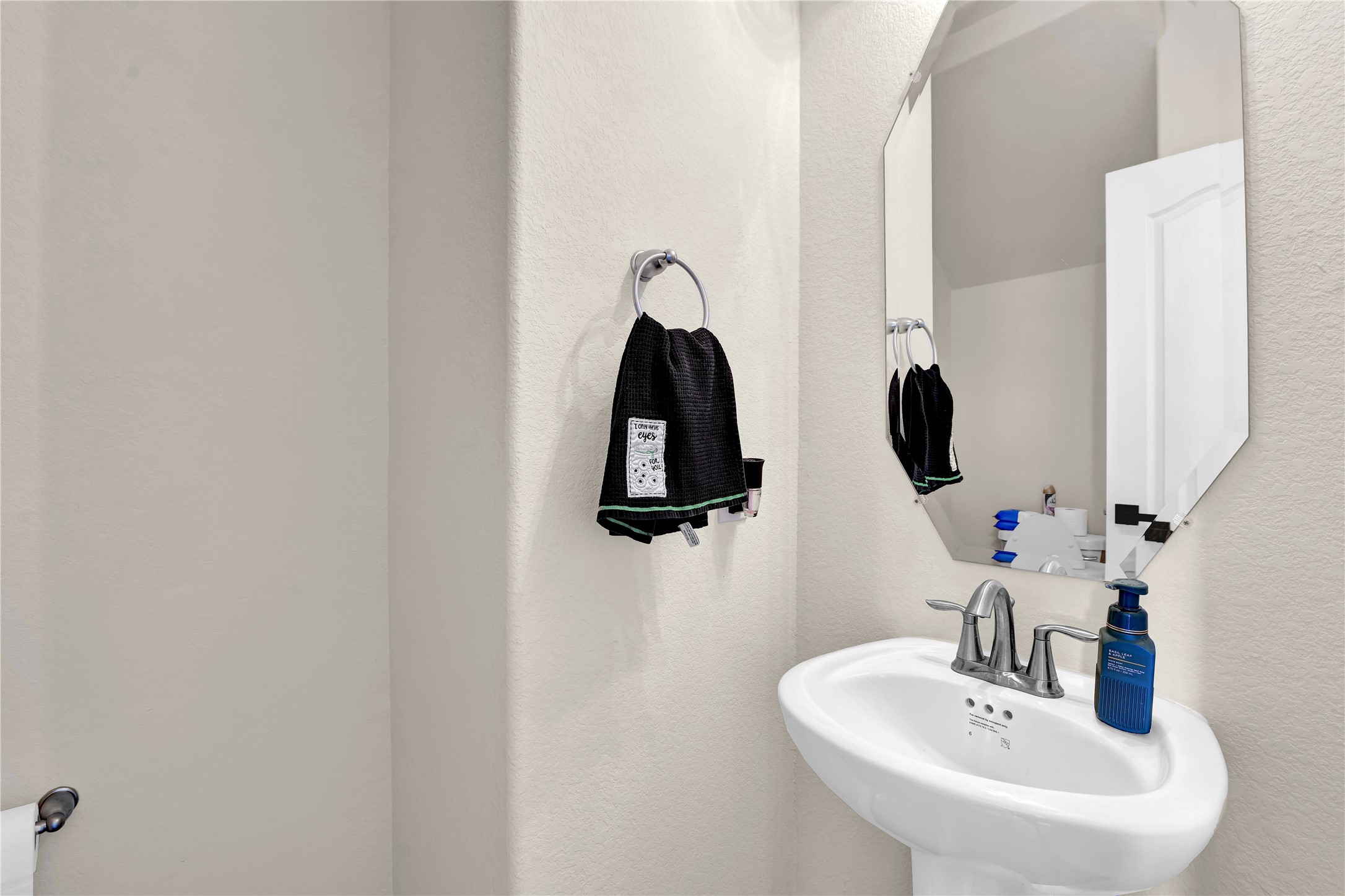 17703 Lion Heart Road Conroe, TX 77306 - Photo 13 of 26 a bathroom with a sink and a mirror