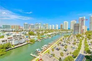 a view of swimming pool of water with lawn chairs and ocean view