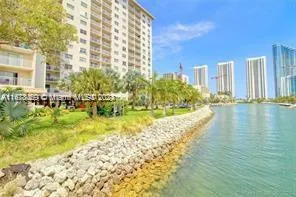 a view of swimming pool with outdoor seating and plants