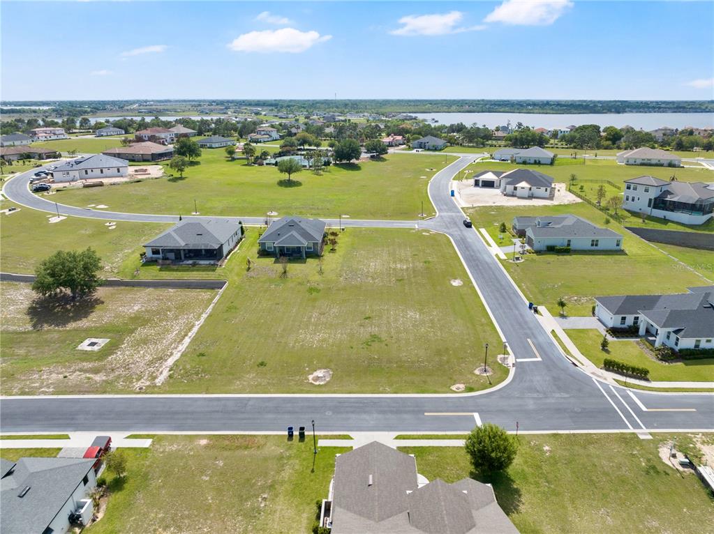 285 Caladium Avenue Lake Alfred, FL 33850 - Photo 14 of 17 an aerial view of residential houses with outdoor space and swimming pool