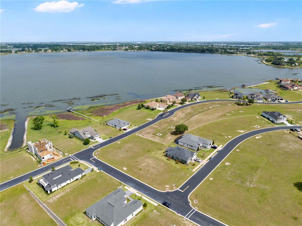 285 Caladium Avenue Lake Alfred, FL 33850 - Photo 8 of 17 an aerial view of a residential houses with outdoor space and lake view