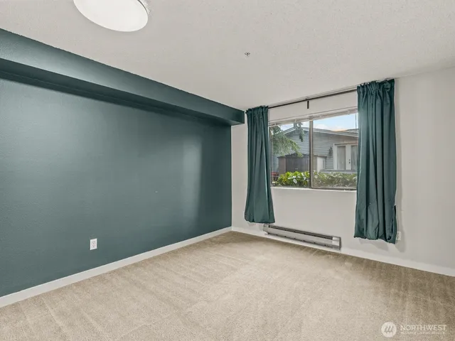 a bathroom with a toilet a sink a vanity and mirror