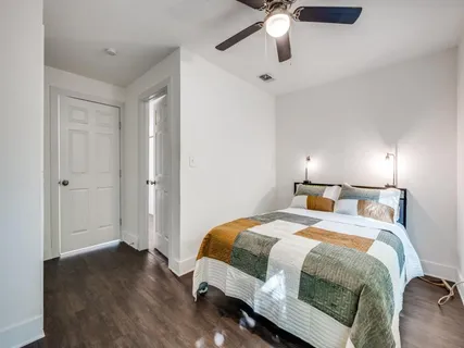 a bed room with a bed and a window