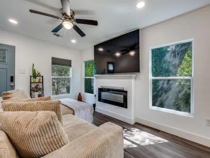 a living room with furniture and a fireplace