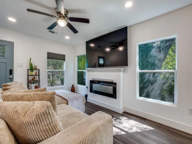 a living room with furniture and a fireplace