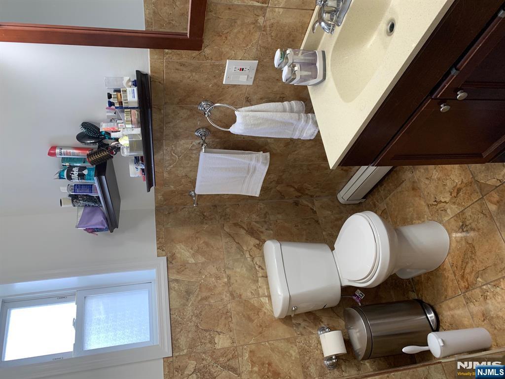 272 Wilson Avenue Fairview, NJ 07022 - Photo 15 of 15 a bathroom with a sink and a toilet