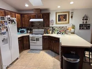a kitchen with a sink cabinets and appliances